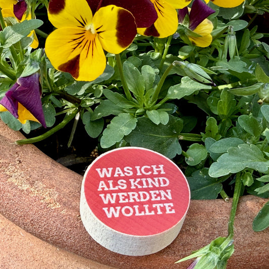 Check-In-Stein mit dem Aufdruck Was ich als Kind werden wollte