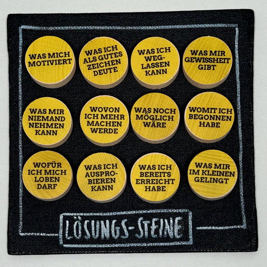 Holzsteine mit stärkenden Aufklebern für Coaching, Supervision und Ressourcenarbeit